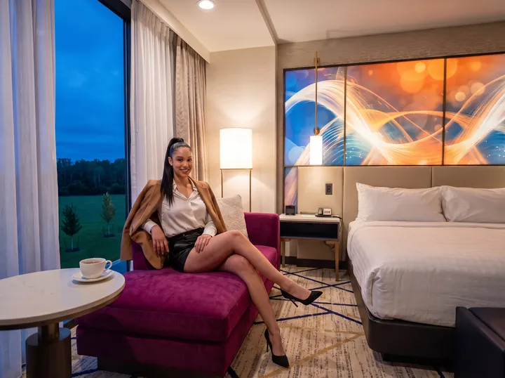 Woman on a chaise in a Hard Rock Ottawa room